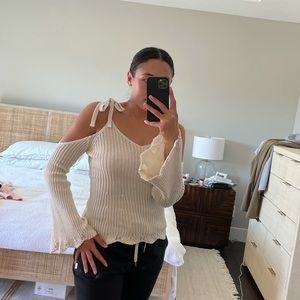 Sweater with bell arms